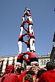 Castellers human towers builders in Plaça de Sant Jaume, La Merce festival, Barcelona. Catalonia, Spain
