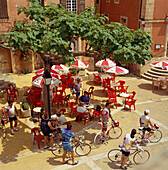 Cafe scene with cyclists, Roussillon, Provence, France