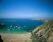 View over bay dotted with boats., La Grande Greve, Sark, UK, Channel Islands