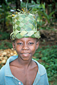 Boy wearing palm leaf hat, Stonetown, Zanzibar, Tanzania