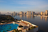 View at the pool of the Grand Hyatt hotel and high rise buildings on the banks of the river Nile, Cairo, Egypt, Africa