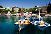 Boats, harbour and city wall under blue sky, Antalya, Turkey, Europe