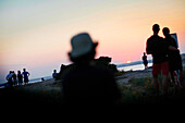 People on the beach at sunset, Pirata Bus beach bar, Formentera, Balearic Islands, Spain