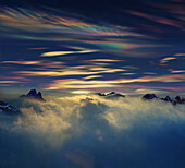 Polar stratospheric clouds above mountain peaks, Antarctic Peninsula, Antartica