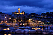 Harbour and Basilica St Michel at night, Menton, Cote d'Azur, France