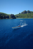 Boat on sea with island in background, General, Viti Levu Island, Fiji