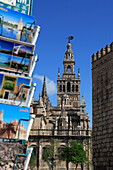 View of Cathedral with postcard rack in foreground, Seville, Andalucia, Spain