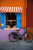 Bicycle and shop window on Burano Island in the Venice Lagoon, Venice, Burano, Veneto, Italy
