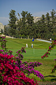 Golfers on golf course, Secret Valley Golf Club, South, Cyprus