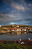 View over Whitby Outer Harbour and hillside town, Whitby, Yorkshire, UK, England