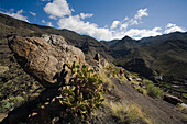 Hiker at the valley of El Risco under blue sky, Parque Natural de Tamadaba, Gran Canaria, Canary Islands, Spain, Europe