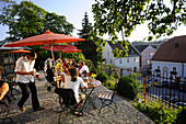 Guest on terrace of a restaurant, Murnau, Bavaria, Germany