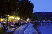Guests in a beer garden at lakefront promenade, Herrsching am Ammersee, Bavaria, Germany