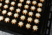 Baking tray with Christmas cookies cinnamon stars