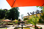 The sunlit courtyard of Hotel Palac Staniszow, Stonsdorf, Bohemian mountains, lower-Silesia, Poland, Europe