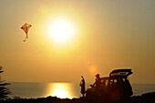 Kiteflying at Capo Sandalo at sunset, Isola di San Pietro, South Sardinia, Italy, Europe