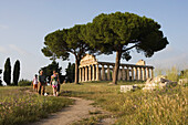 Tourists at the temple of Athena, UNESCO world heritage site, Paestum, Cilento, Campania, Italy