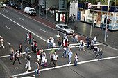 Pedestrians crossing street,  George St,  Sydney,  Australia