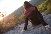 Young woman sitting,  Bear Mountain State Park,  New York State,  USA