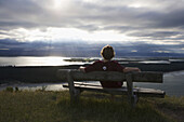 Alone, Back view, Bench, Boy, Color, Colour, Contemporary, Dramatic, Holiday, Holidays, Island, Islands, New Zealand, North island, Solitary, Solitude, Teen, Teenager, Travel, Vacation, Vacations, View, World Travel, F57-872063, agefotostock 