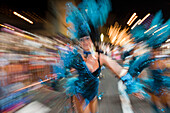 Women in colourful costumes at the Carnival Parade, Funchal, Madeira, Portugal