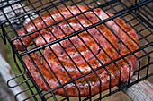 Perfectly grilled coiled sausage on a barbeque, Paul da Serra, Madeira, Portugal