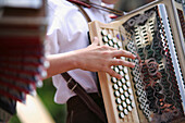 Boy playing accordion, Styria, Austria