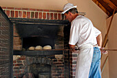 Baking Of Round Loaves Of Bread In The Old Oven, Beville-Le-Comte, The Wheat Route, Eure-Et-Loir (28), France