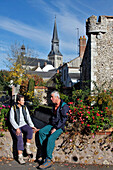 Strollers In Front Of The Notre-Dame Church And The Defense Towers Surrounding The Town, Bonneval, Eure-Et-Loir (28), France