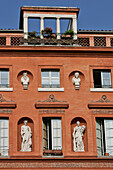 Facade Of A Red Brick Building With Statues, Place De La Trinite, Les Carmes Neighborhood, Toulouse, Haute-Garonne (31), France