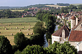 Village And Bale Of Straw In A Field, Noyers-Sur-Serein Yonne (89), Burgundy, France