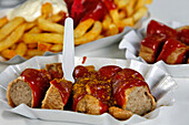 Seasoned Currywurst (Sausage In Curry, A Traditional Dish) In Tomato Sauce With Cayenne Pepper And Curry Powder, Berlin, Germany