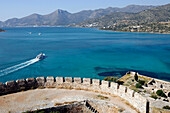 Venetian Fortress On The Isle Of Spinalonga And Boat In The Gulf Of Mirabello, Crete, Greece