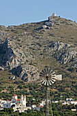 Wind Turbine At The Foot Of A Mountain, Crete, Greece