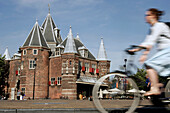 Bicycles In Front Of 'De Waag', Medieval Tower Of The Saint Anthony Gate, Nieuwmarkt Square, Amsterdam, Netherlands