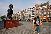 Statue Of Multatuli And Sidewalk Cafe On The Torensluis Bridge