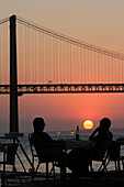 Sunset Over The 25Th Of April Bridge, Cacilhas Across From Lisbon On The Other Bank Of The Tagus, Portugal