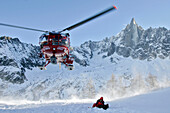 Rescue Workers Boarding A Helicopter Of The Civil Emergency Services, The Pas De La Chevre Ice Cascade, The Fire Department'S Mountain Rescue Group, Haute-Savoie, France
