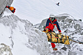 Firefighter In Action, Winter Exercise In The Alps, Conditioning Of A Victim On A Stretcher And Preparation Of The Relay For His Evacuation, Emergency Service Mountain Squad (Gmsp74), Petite Aiguille Verte, Mont-Blanc, Haute-Savoie (74), France