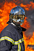 Fireman In Front Of A Wall Of Flames Before Attacking A Lpg (Light Petroleum Gas) Fire, Sdis Of Morbihan, Vannes, Morbihan (56), France