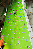 Woman climbing, Rosenheim, Upper Bavaria, Bavaria, Germany