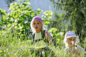 Two girls in a meadow, Bavarian Alps, Upper Bavaria, Bavaria, Germany