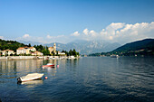 View over Lake Como to Tremezzo with Bergamo Alps in background, Lombardy, Italy