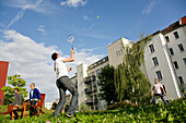 Two men playing badminton, Leipzig, Saxony, Germany