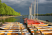 Machsee Lake in Hannover, sailing boats, rowing boats, black sky, coming storm, colorful, Lower Saxony, northern Germany