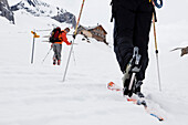 Two back-country skiers near a Wildhorn mountain lodge, Bernese Oberland, Canton of Bern, Switzerland
