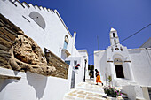 House with sculpture and church in the sunlight, Pirgos, island of Tinos, the Cyclades, Greece, Europe