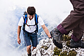 Man ascenting Sonntagkarspitze, Innsbruck, Karwendel range, Tyrol, Austria