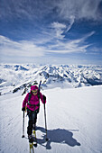 Back country skier ascending mount Weisskugel, Oetztal Alps, Tyrol, Austria