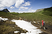 Woman hiking near Gruber Pass, Montafon, Vorarlberg, Austria, MR